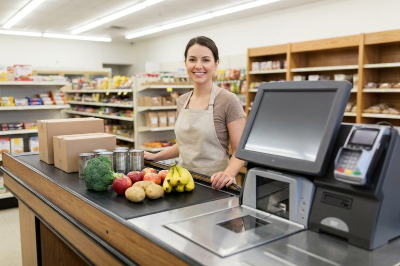 Grocery checkout lane with produce and a scale